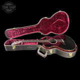 Guitar in a red case with 'Tone Shop' logo in the corner