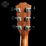Guitar headstock with tuning pegs on a black background, featuring 'Tone Shop' logo.