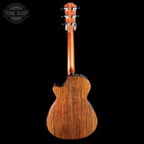 Back view of a wooden ukulele with 'Tone Shop' logo in the corner.