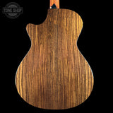 Wooden guitar back with 'Tone Shop' logo in the corner