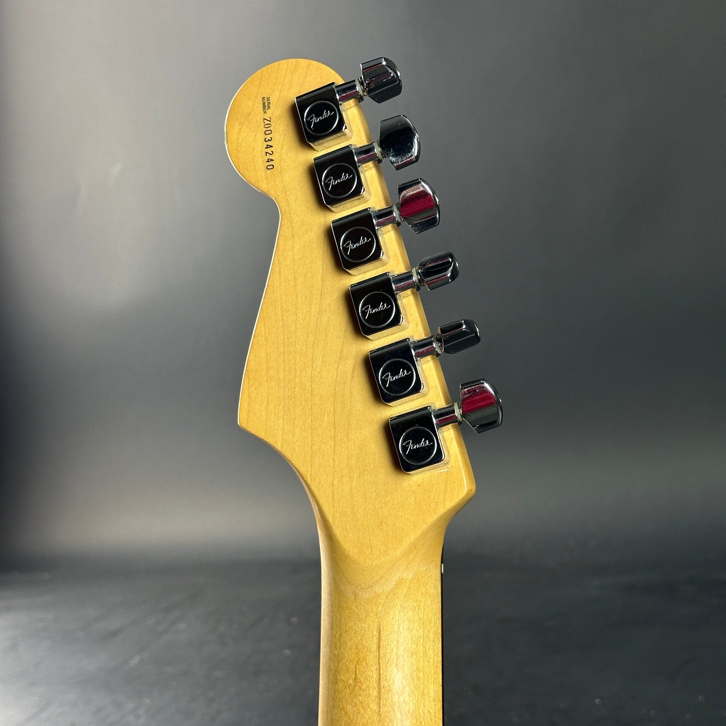 Back of headstock of Used 2000 Fender American Standard Stratocaster Sunburst.