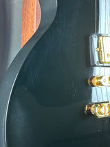 Close-up of a guitar's soundhole and bridge