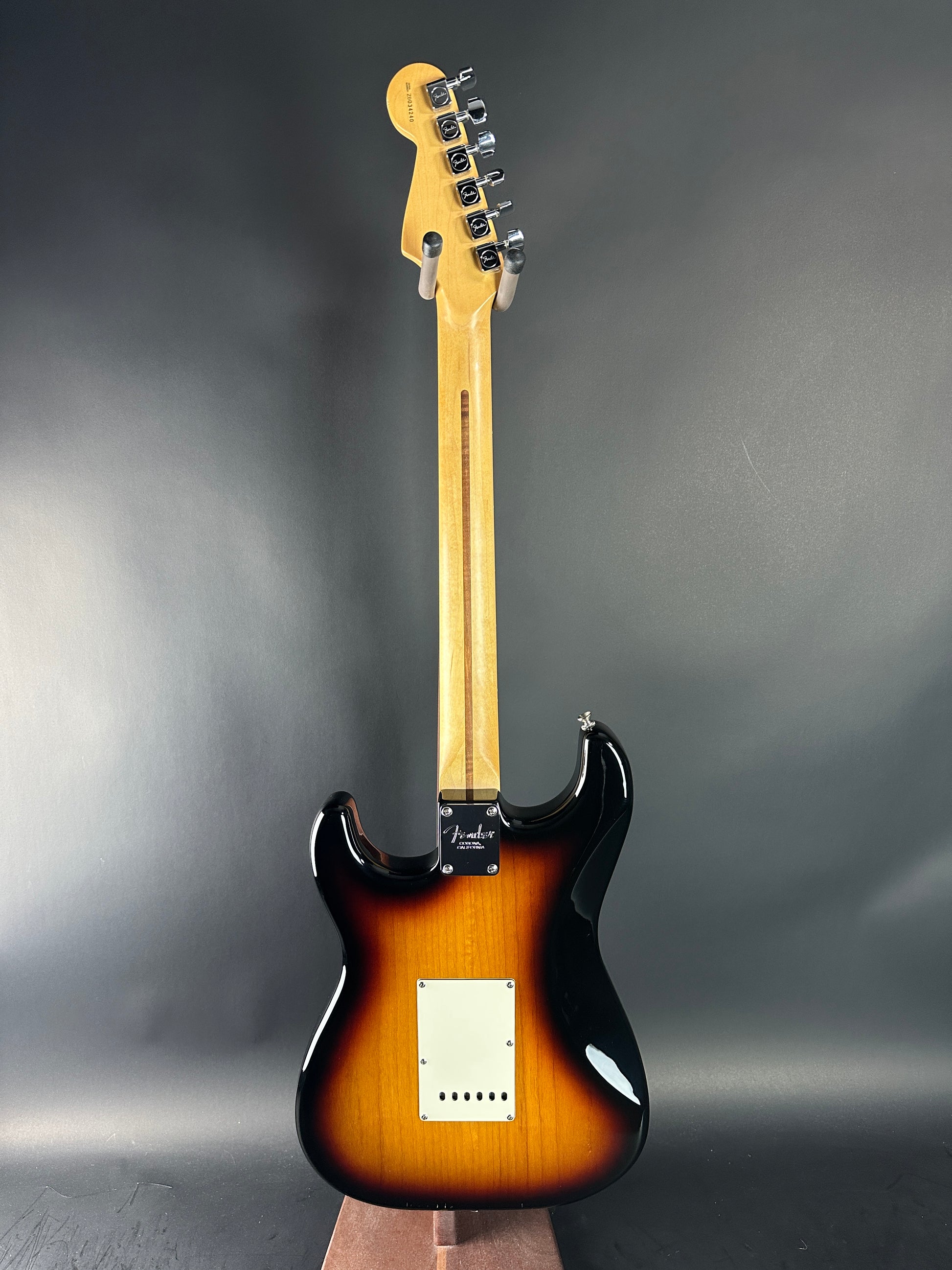 Electric guitar with sunburst finish on a gray background