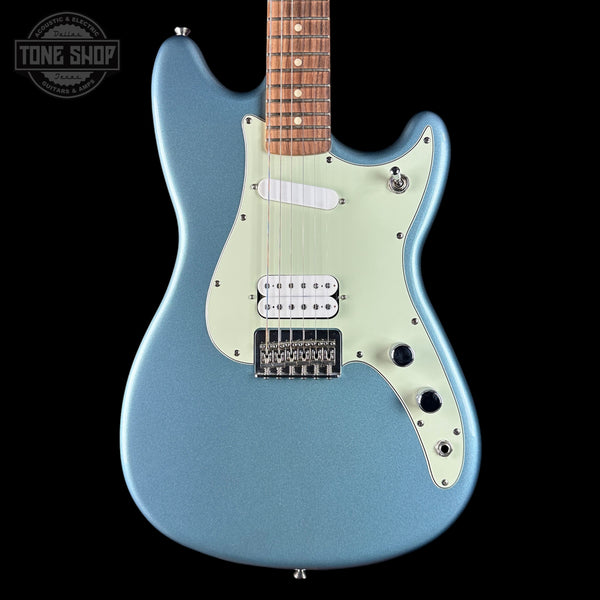 Blue electric guitar with a black background