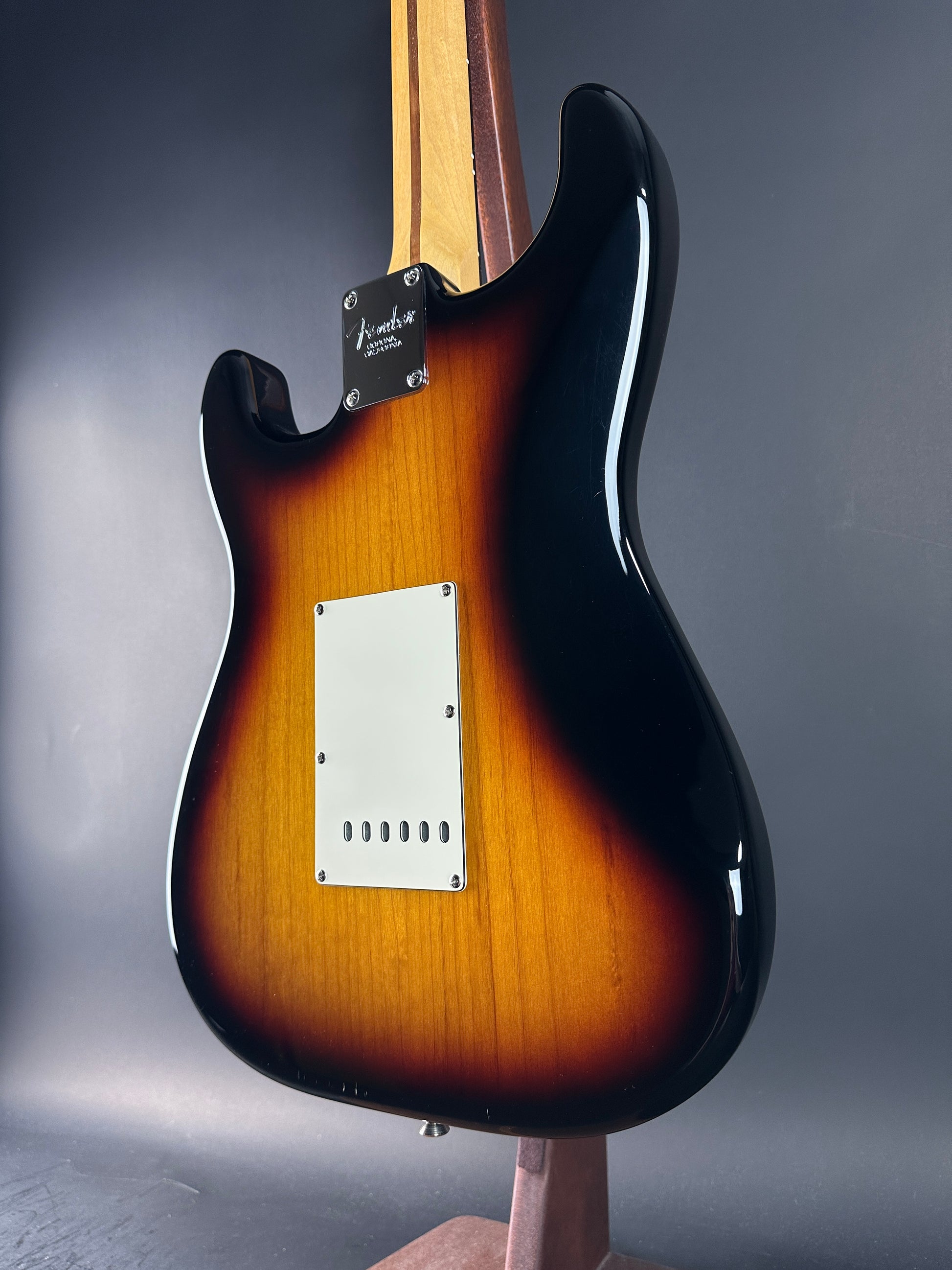 Guitar body with sunburst finish on a gray background