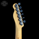 Guitar headstock with tuning pegs on a black background, featuring 'Tone Shop' logo.