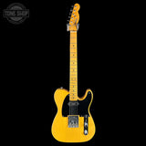 Yellow electric guitar on a black background with 'Tone Shop' logo.