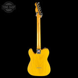 Yellow electric guitar on a black background with 'Tone Shop' logo.
