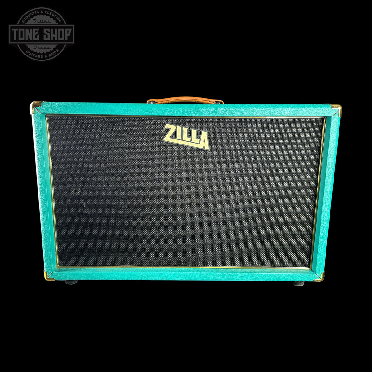 A Zilla guitar amplifier cabinet with a turquoise green frame, black speaker grille, and gold Zilla logo, shown against a black background with a Tone Shop watermark in the top left.