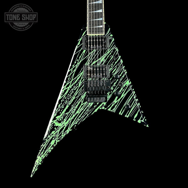 Glossy black electric guitar with green accents on a black background, featuring 'Tone Shop' logo.