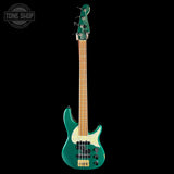 Green electric bass guitar on a black background with 'Tone Shop' logo.
