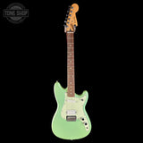 A mint green Fender Stratocaster electric guitar with a natural wood neck and headstock, shown against a solid black background. A 'TONE SHOP' watermark is visible in the top-left corner.