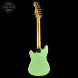 A mint green electric guitar shown from the back against a solid black background, with a Tone Shop watermark in the top-left corner.