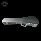 Black guitar case with 'Tone Shop' logo in the corner