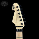Guitar headstock with brand logo on a black background