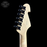 Guitar headstock with tuning pegs on a black background, featuring the Tone Shop logo.