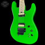 Green electric guitar with a 'Tone Shop' logo in the corner