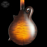 Close-up of a wooden mandolin with a dark background