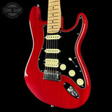 Red electric guitar with a black background