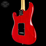 Red electric guitar with a visible brand logo on a black background