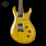 Electric guitar with a sunburst finish on a black background, featuring the Tone Shop logo.
