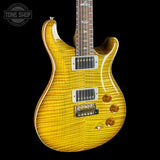 Electric guitar with a sunburst finish on a black background, featuring the Tone Shop logo.
