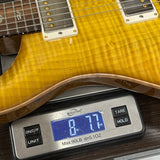 Sunburst guitar on a digital scale. 