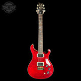 Red electric guitar on a black background with 'Tone Shop' logo.