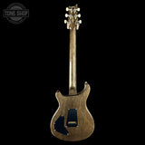 Guitar body with headstock on a black background, featuring 'Tone Shop' logo.