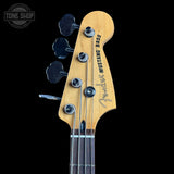 Fender Mustang Bass headstock with brand logo on a black background