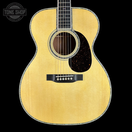 Acoustic guitar with a visible brand logo in the corner