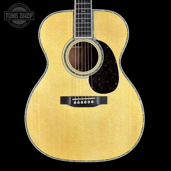 Acoustic guitar with a visible brand logo in the corner