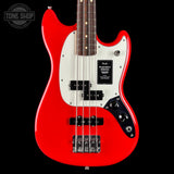 Red electric bass guitar with a white pickguard on a black background, featuring the Fender logo.
