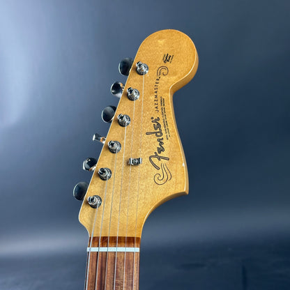 Fender guitar headstock on a dark blue background