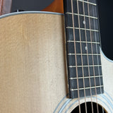 Wear near fretboard of Used Taylor 210ce.