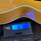 Used 2024 Gretsch G2420 Streamliner Natural on scale displaying weight.