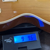 Used 2022 Gibson Les Paul Classic Honeyburst on scale displaying weight.