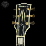 Guitar headstock with 'Edwards' branding on a black background