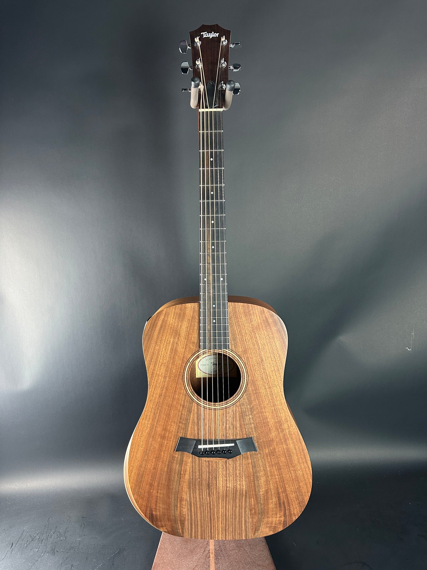 Acoustic guitar on a gray background