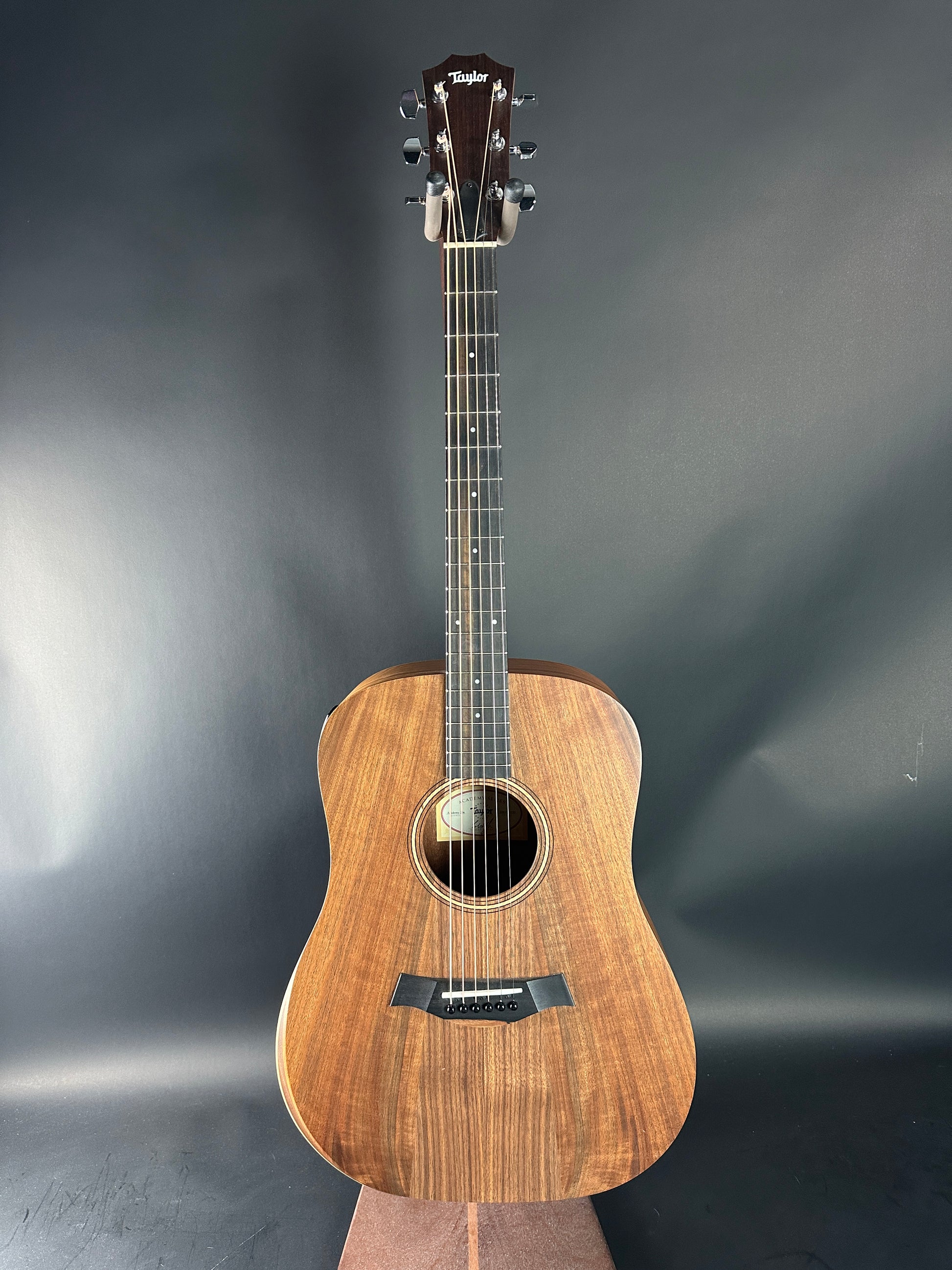 Acoustic guitar on a gray background