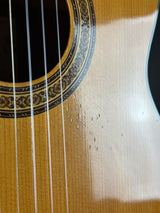 Close-up of a guitar's soundhole and strings