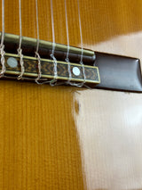 Close-up of a guitar's soundhole and strings