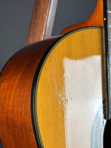 Close-up of a wooden acoustic guitar's soundhole and body