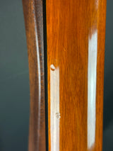 Close-up of a wooden surface with a white strip and black line