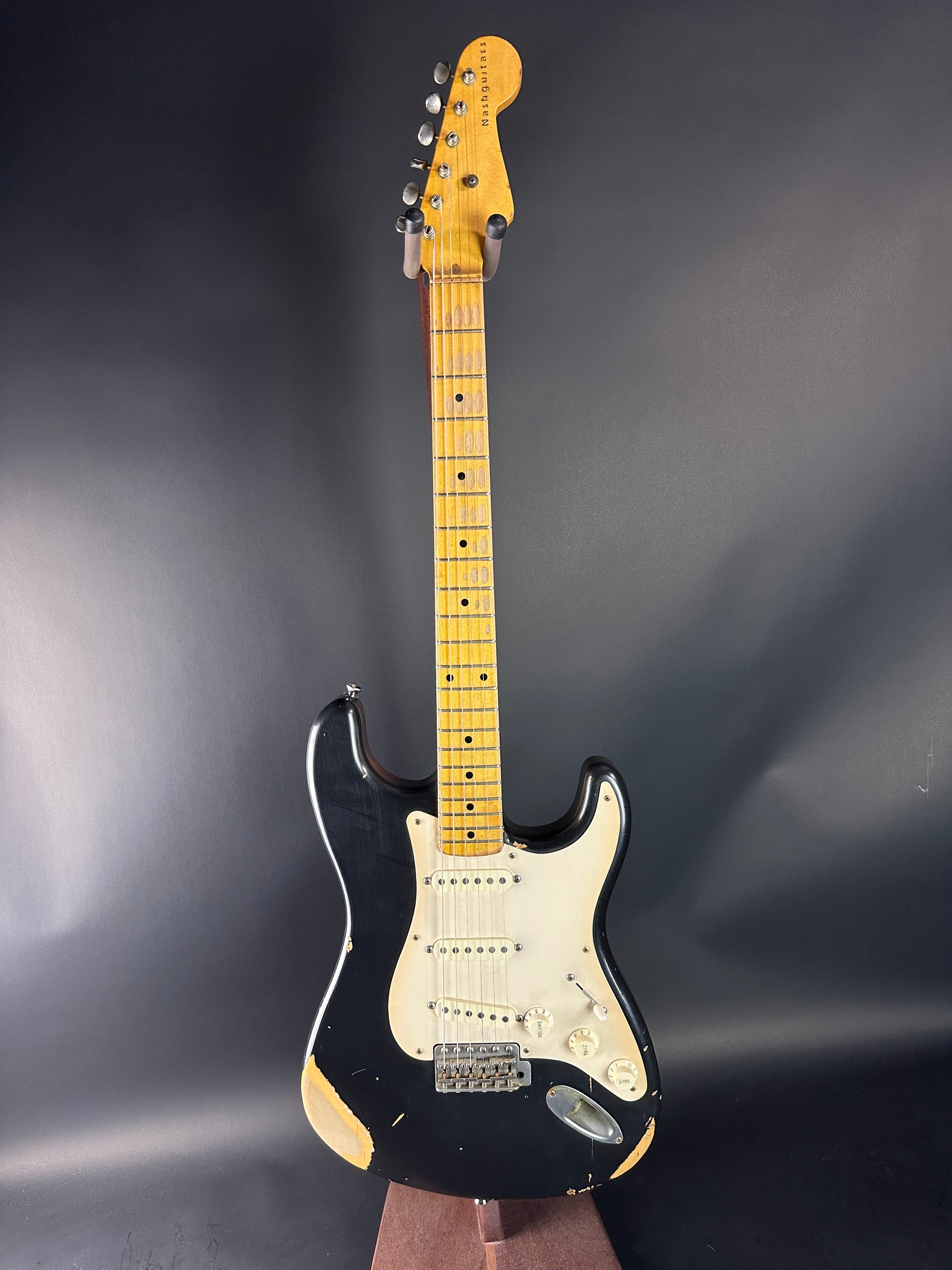 Electric guitar with a black and white design on a dark background