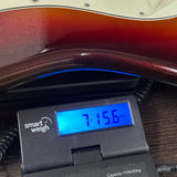 Used 2014 Fender American Deluxe Stratocaster Plus Sunburst on scale displaying weight.