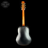 Black acoustic guitar headstock on a black background with 'Tone Shop' logo.