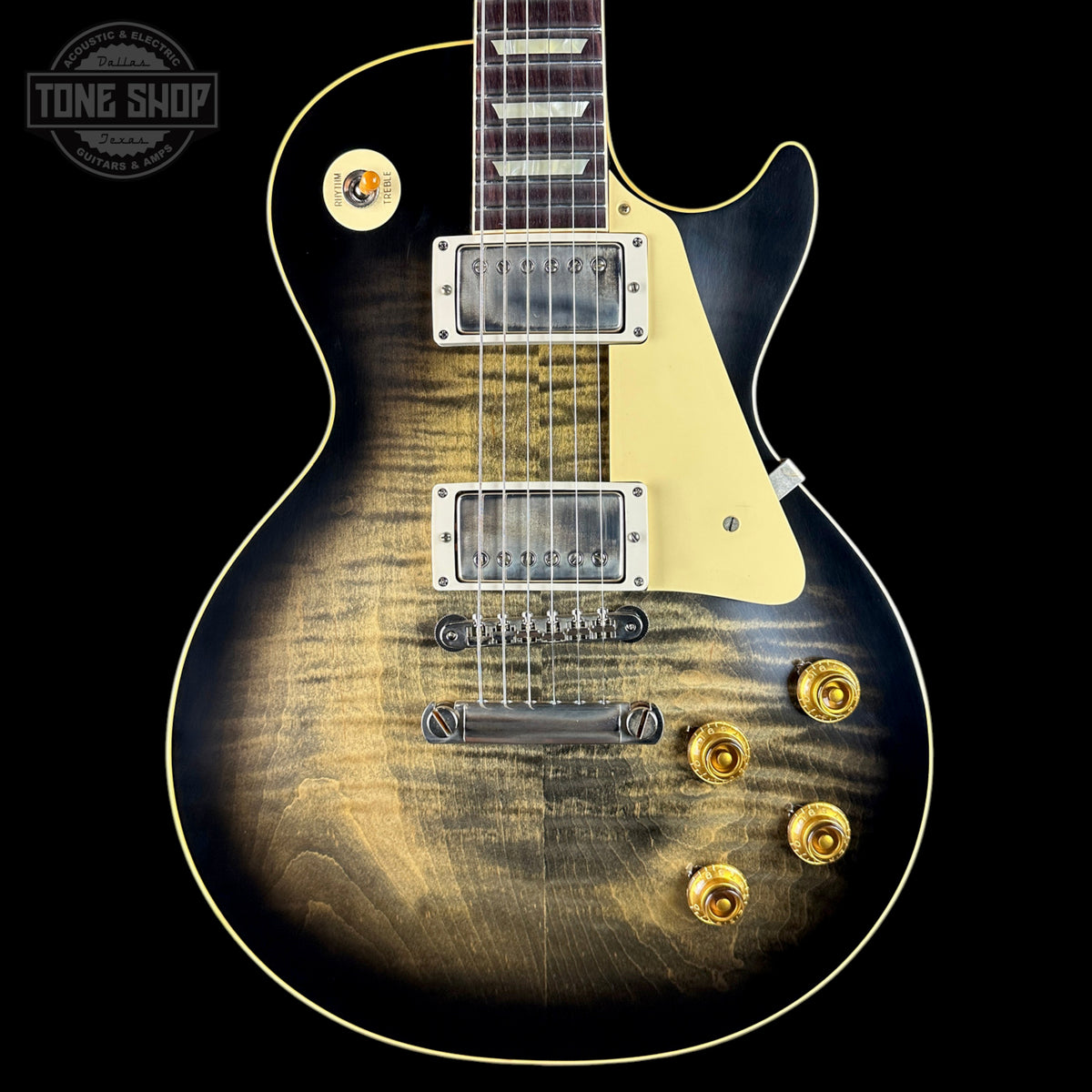 Electric guitar with a sunburst finish on a black background, featuring the Tone Shop logo.