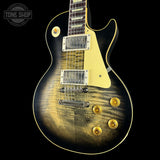 Electric guitar with a sunburst finish on a black background, featuring the Tone Shop logo.