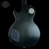 Gibson electric guitar back with brand logo on a black background